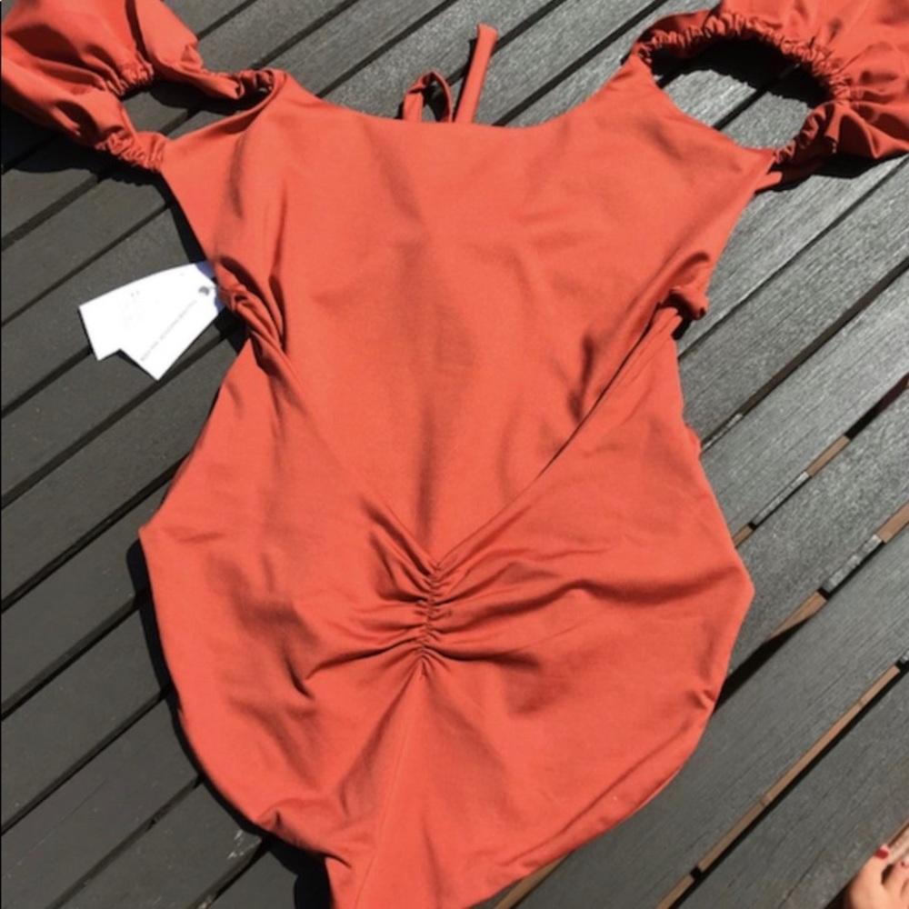 Londre Ruffle Shoulder One Piece.